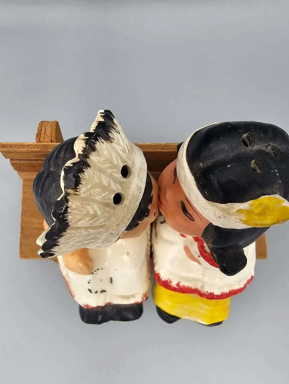 Vintage Ceramic Native American Couple Salt and Pepper Shakers on Wooden Bench